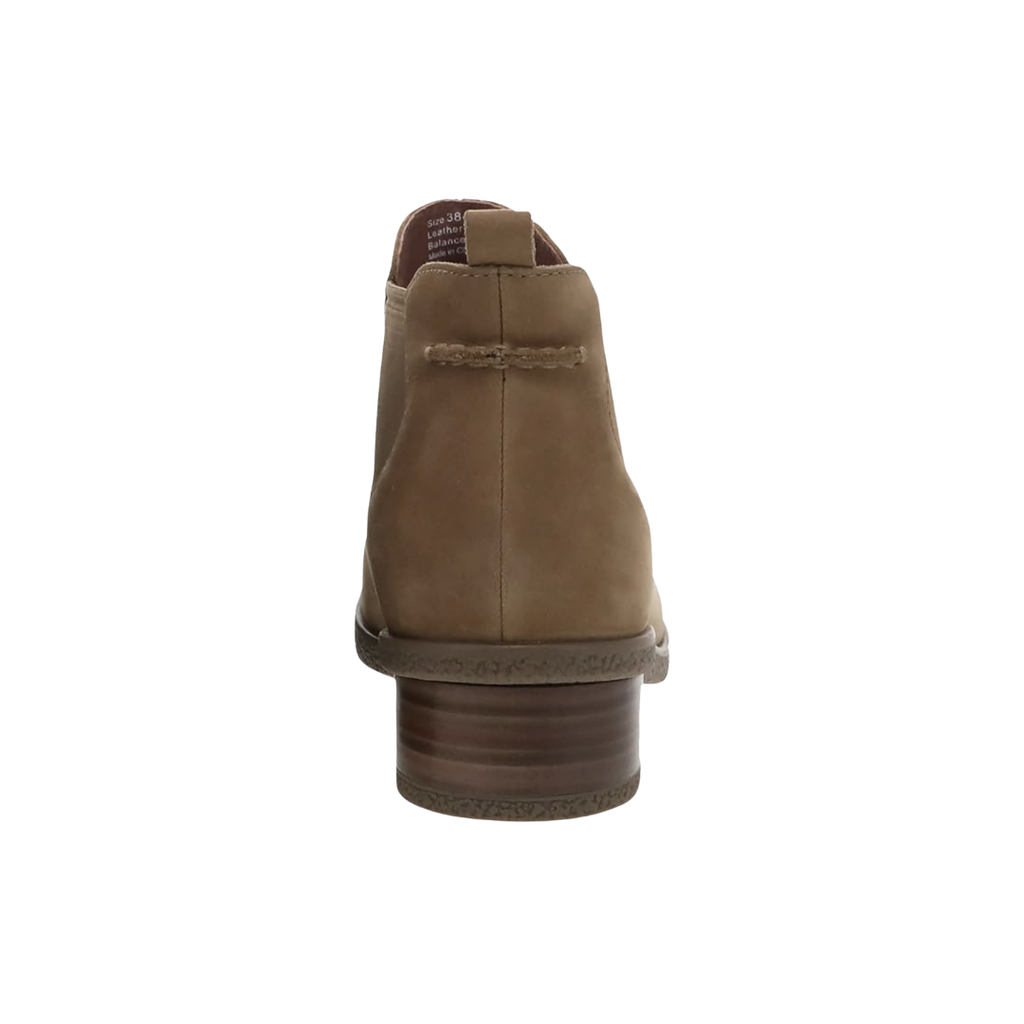 Back heel view of the Dansko Women’s Bea Ankle Boot in Biscotti highlighting the leather stacked heel with water-repellent treatment, reinforced heel construction, supportive ankle height, cushioned footbed, and durable TR rubber outsole designed to improve stability, reduce fatigue, and provide confident traction throughout the day.