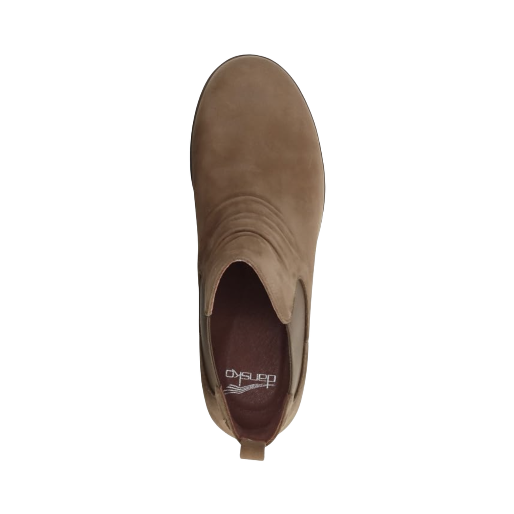 Top view of the Dansko Women’s Bea Ankle Boot in Biscotti displaying the waterproof leather upper, leather and textile linings, removable molded EVA footbed with memory foam, Dansko Natural Arch® technology, and orthotic-friendly design engineered to provide breathable comfort, cushioning, and lasting support.
