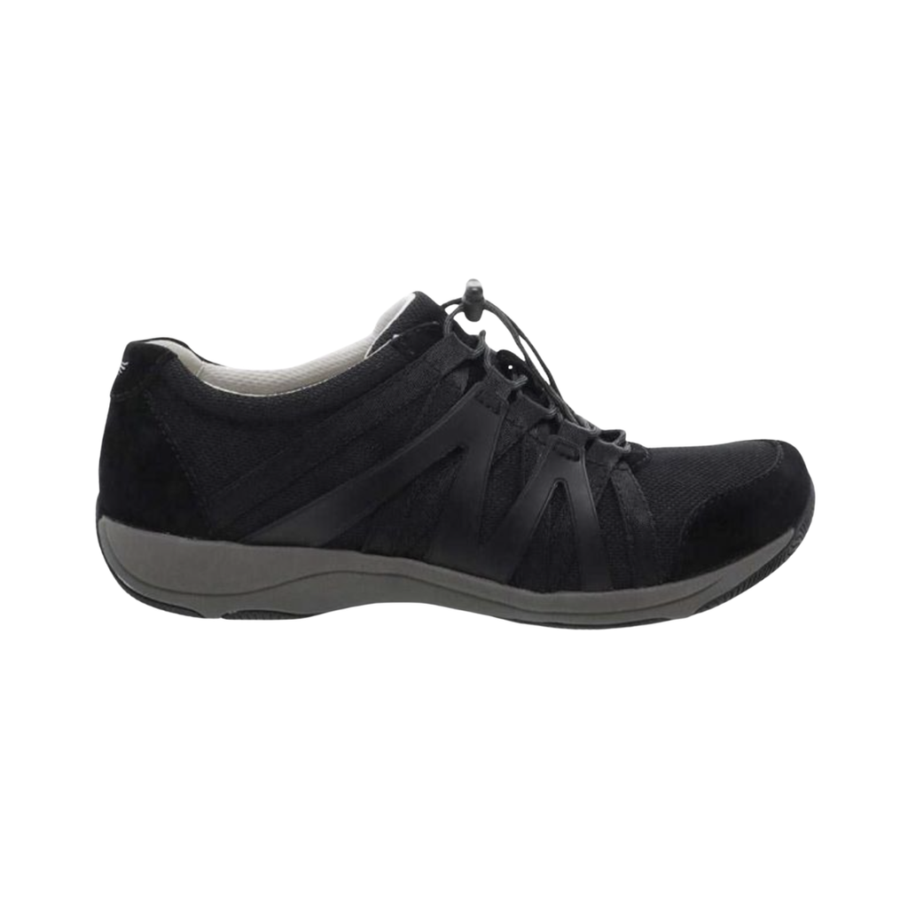Dansko Women’s Henriette Suede Shoe in Black featuring a premium suede and recycled mesh upper, sporty low-top silhouette, adjustable bungee laces, removable EVA footbed, Strobel construction, natural rubber outsole, and lightweight design built for breathable comfort, flexibility, and all-day support.