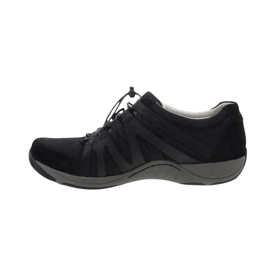 Dansko Women’s Henriette Suede Shoe in Black featuring a premium suede and recycled mesh upper, sporty low-top silhouette, adjustable bungee laces, removable EVA footbed, Strobel construction, natural rubber outsole, and lightweight design built for breathable comfort, flexibility, and all-day support.