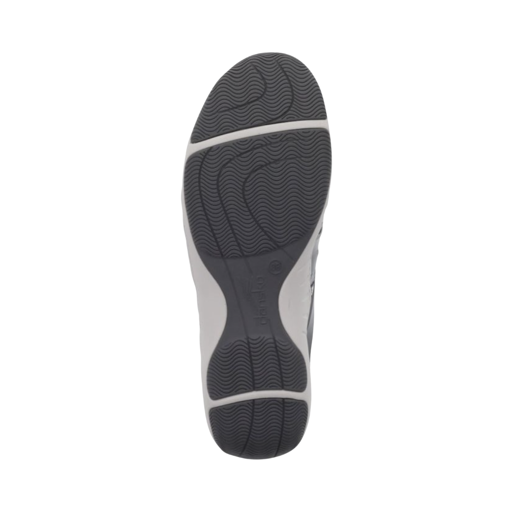 Bottom outsole view of the Dansko Women’s Henriette Suede Shoe in Grey featuring the durable natural rubber outsole engineered to provide reliable traction and slip-resistant stability across a variety of everyday surfaces while the cushioned EVA footbed and supportive construction help provide comfort for conditions such as plantar fasciitis, flat feet, metatarsalgia, heel pain, mild overpronation, arthritis discomfort, and general foot fatigue.