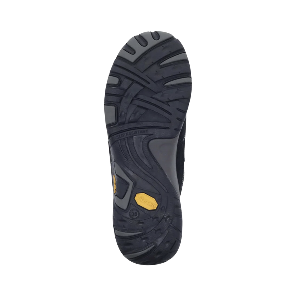 Bottom outsole view of the Dansko Women’s Paisley Suede Shoe in Black featuring the slip-resistant Vibram® rubber outsole engineered to provide exceptional traction on wet, dry, and uneven surfaces while the shock-absorbing midsole, removable cushioned footbed, and supportive construction help provide comfort for conditions such as plantar fasciitis, flat feet, heel pain, overpronation, and general foot fatigue.