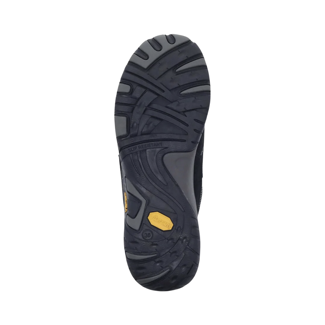 Bottom outsole view of the Dansko Women’s Paisley Suede Shoe in Black featuring the slip-resistant Vibram® rubber outsole engineered to provide exceptional traction on wet, dry, and uneven surfaces while the shock-absorbing midsole, removable cushioned footbed, and supportive construction help provide comfort for conditions such as plantar fasciitis, flat feet, heel pain, overpronation, and general foot fatigue.