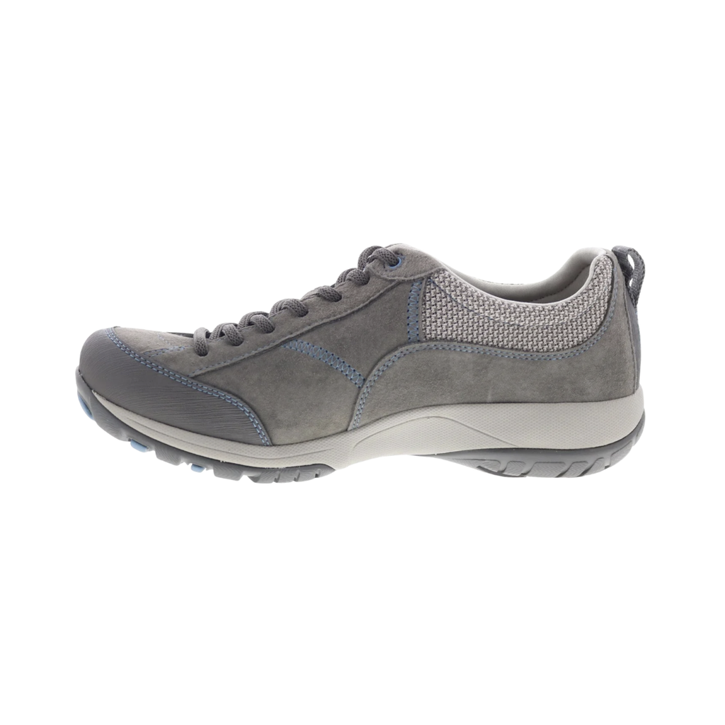 Dansko Women’s Paisley Suede Shoe in Grey/Blue featuring a waterproof suede upper, low-profile hiking-inspired silhouette, seam-sealed construction, Dansko Natural Arch® technology, removable triple-density EVA footbed, shock-absorbing midsole, Vibram® rubber outsole, and durable design built for all-day comfort, stability, and outdoor performance.