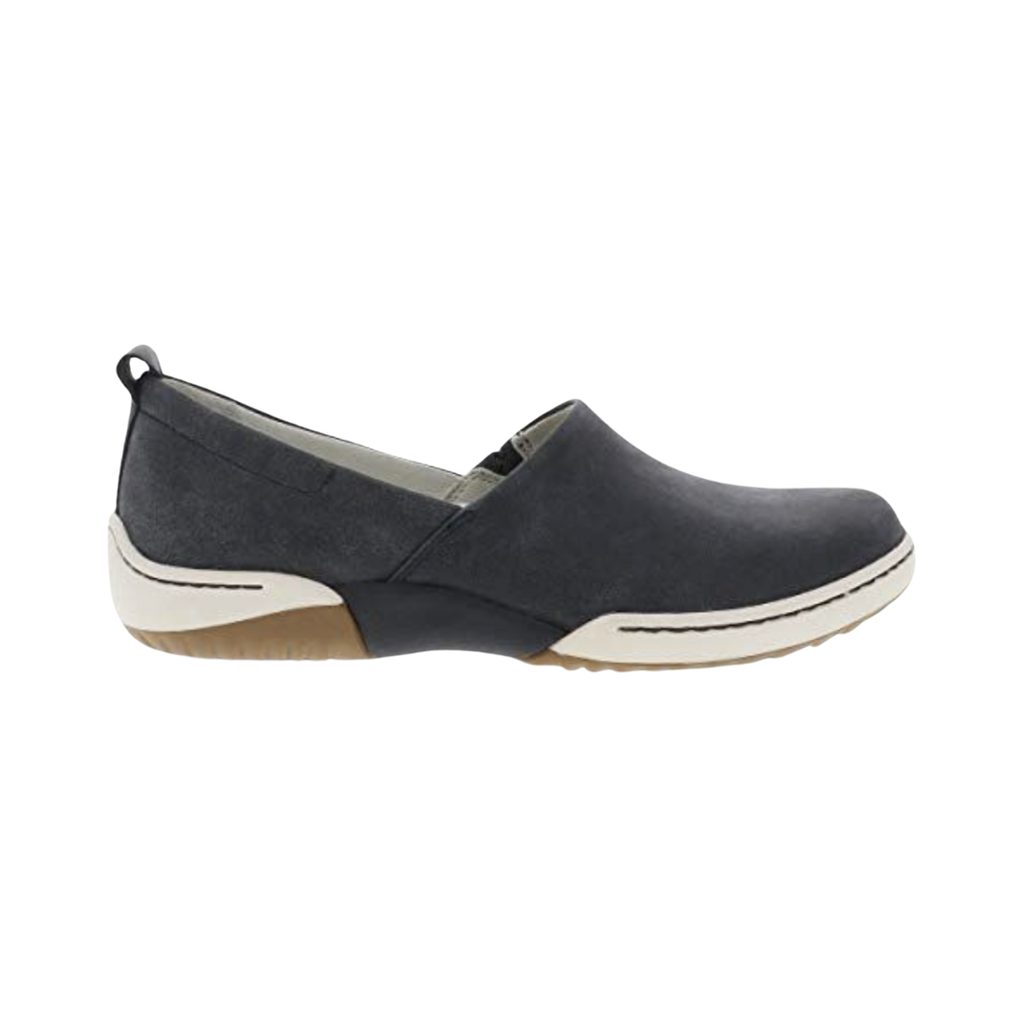 Dansko Women’s Reba Vintage Slip-On Shoe in Black featuring a soft leather upper, streamlined slip-on silhouette, Dansko Natural Arch™ technology, lightweight EVA midsole, durable outsole, and refined everyday design built for lasting comfort, stability, and effortless wear.