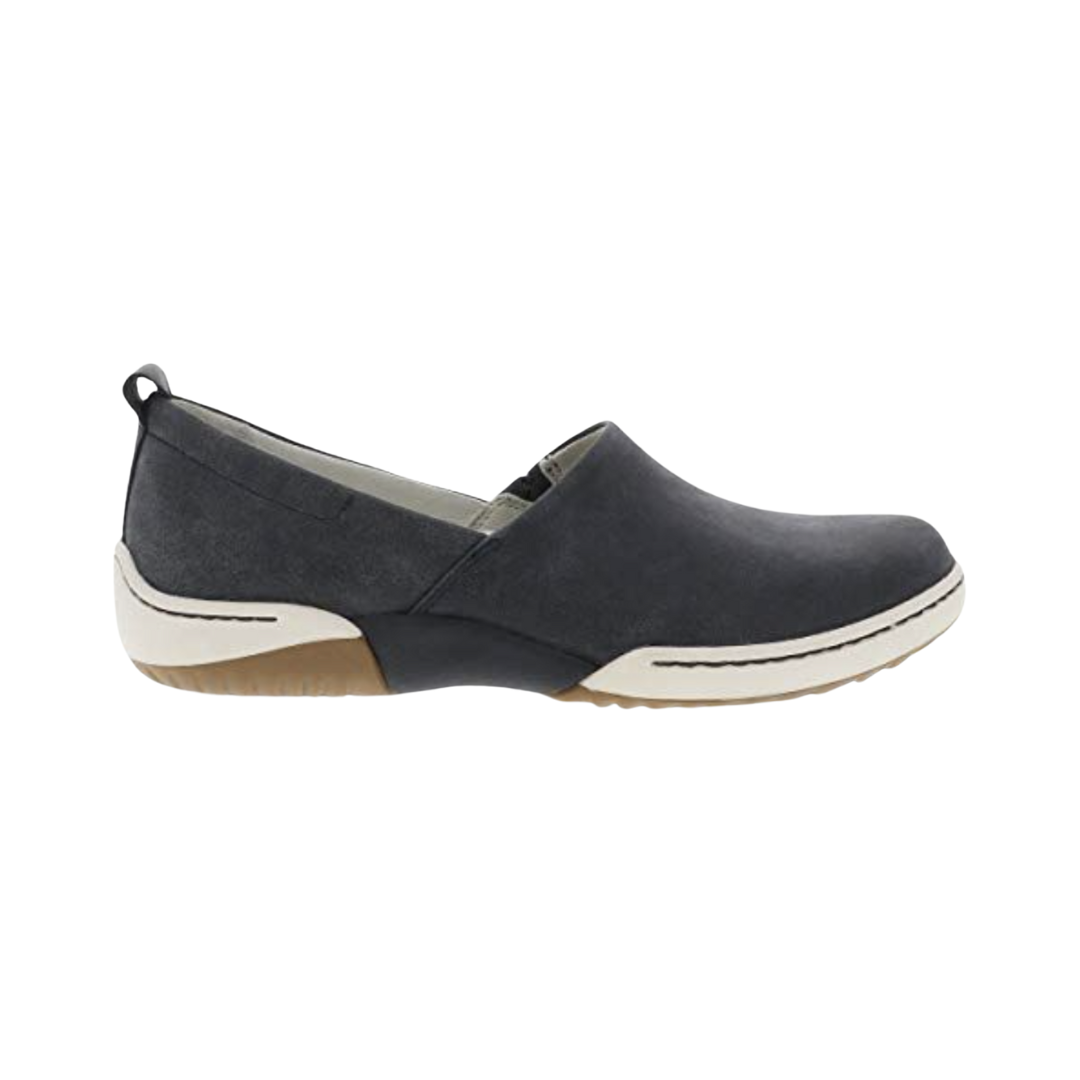 Dansko Women’s Reba Vintage Slip-On Shoe in Black featuring a soft leather upper, streamlined slip-on silhouette, Dansko Natural Arch™ technology, lightweight EVA midsole, durable outsole, and refined everyday design built for lasting comfort, stability, and effortless wear.