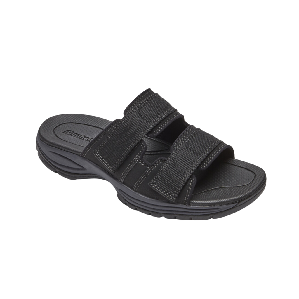 Dunham Men’s Newport Waterproof Slide in Black featuring a waterproof full-grain leather upper, easy slip-on design, lightweight EVA midsole, nylon shank for stability, and slip-resistant rubber outsole designed for convenient all-weather comfort and dependable support.