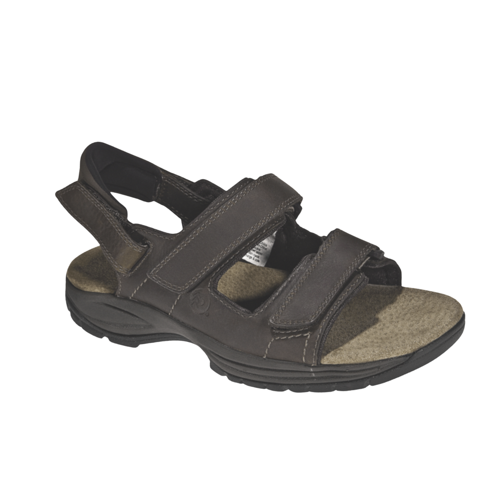 Dunham Men’s St. Johnsbury Sandal in Brown Leather featuring a premium leather upper, three-point adjustable hook-and-loop strap system, Stability R-Bar technology, nylon shank, moisture-wicking lining, and durable rubber outsole designed for supportive comfort on city streets, trails, and everyday adventures.