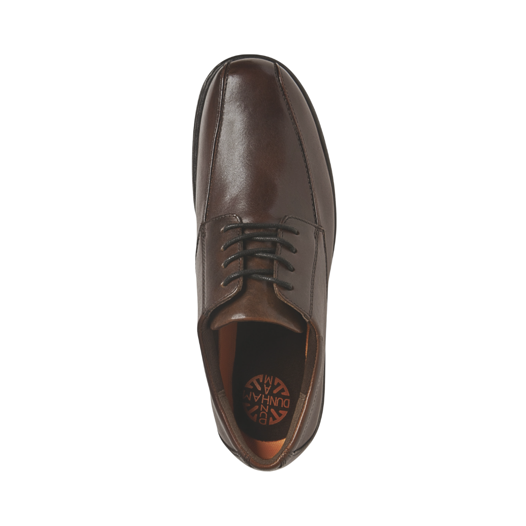 Top view of the Dunham Men’s Bryce Oxford in Brown displaying the full-grain leather upper, secure lace-up system, removable EVA and memory foam footbed, supportive interior construction, and orthotic-friendly design engineered to provide cushioning, stability, and a personalized fit.