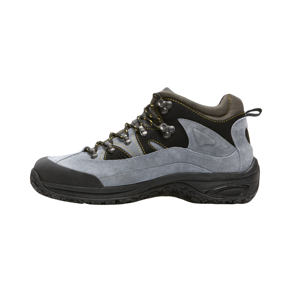Dunham Men’s Cloud Waterproof Boot in Slate featuring a seam-sealed waterproof leather upper, supportive boot silhouette, Stability R-Bar technology, removable molded footbed, lightweight EVA midsole, nylon shank, padded collar, and slip-resistant rubber outsole designed for dependable all-weather comfort and stability.