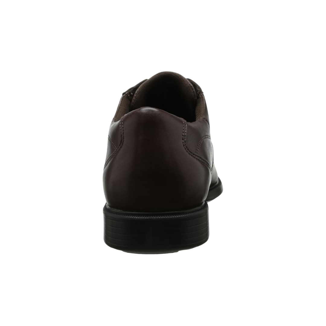 Back heel view of the Dunham Men’s Douglas Bike Front Oxford in Brown highlighting the supportive heel construction, cushioned collar, Stability R-Bar® technology, nylon shank, shock-absorbing EVA midsole, and durable rubber outsole designed to improve stability and reduce foot fatigue throughout the day.