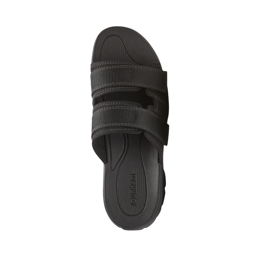 Top view of the Dunham Men’s Newport Waterproof Slide in Black displaying the waterproof full-grain leather upper, open slip-on design, spacious footbed, and supportive construction designed to provide a comfortable fit while helping protect against wet conditions.