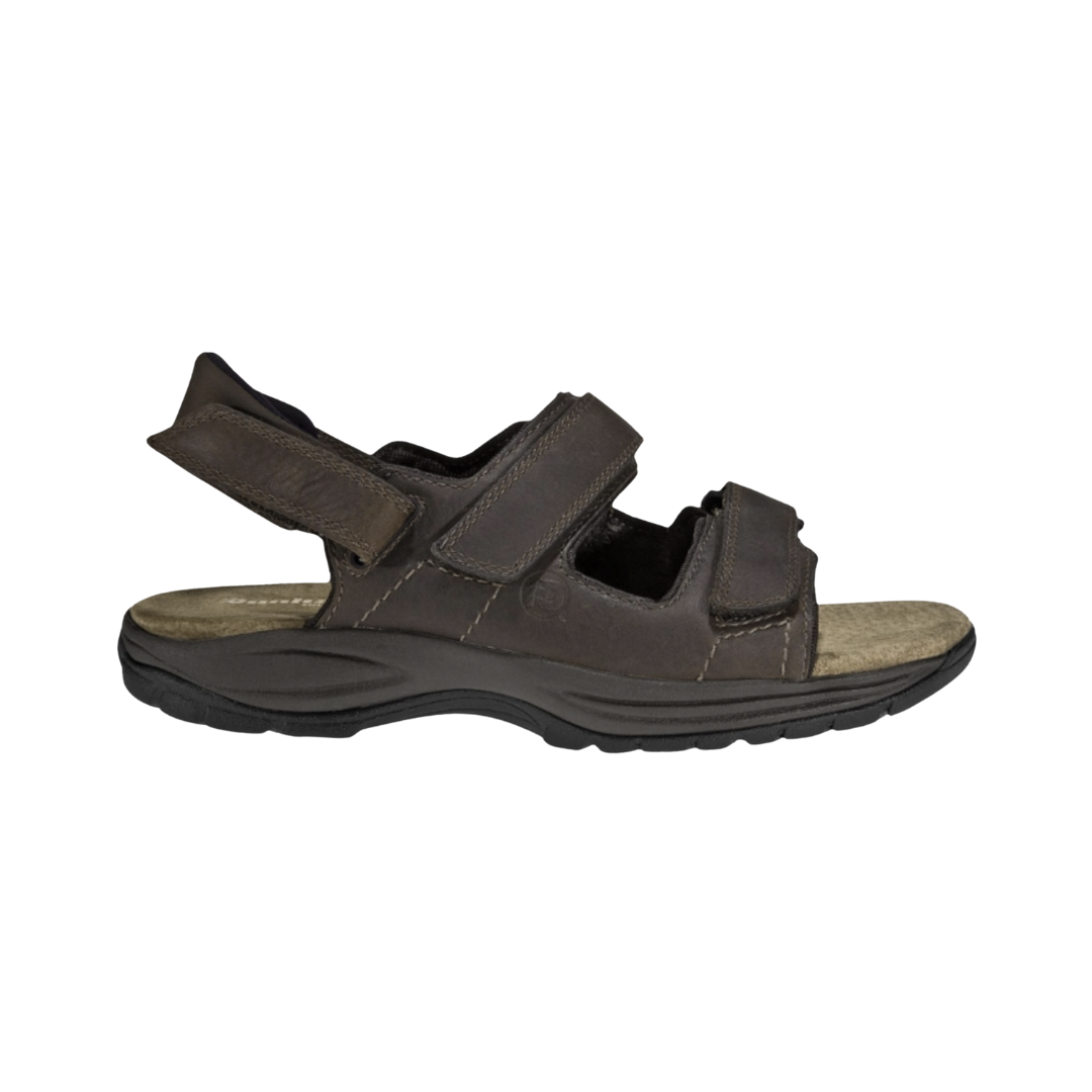 Dunham Men’s St. Johnsbury Sandal in Brown Leather featuring a premium leather upper, three-point adjustable hook-and-loop strap system, Stability R-Bar technology, nylon shank, moisture-wicking lining, and durable rubber outsole designed for supportive comfort on city streets, trails, and everyday adventures.