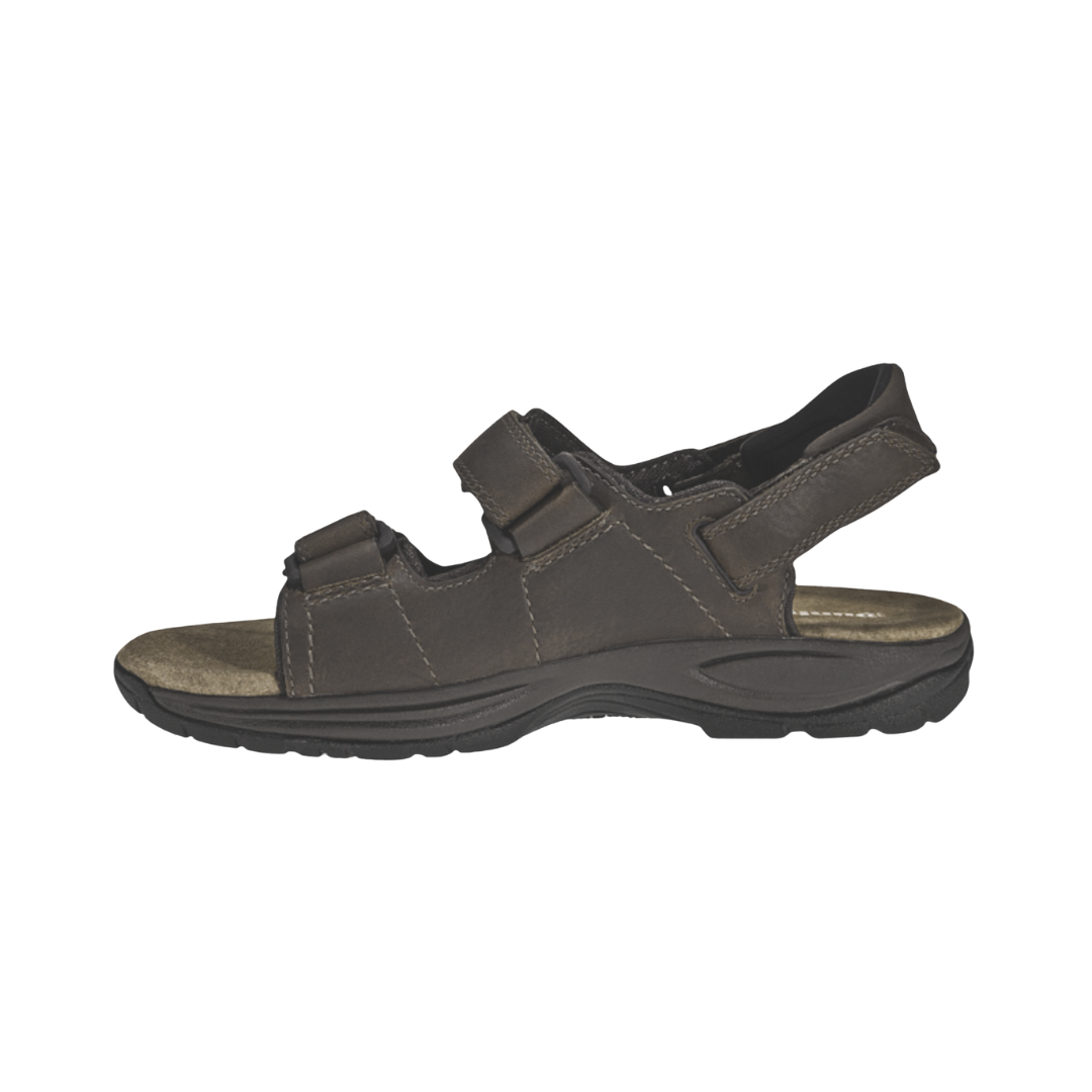 Dunham Men’s St. Johnsbury Sandal in Brown Leather featuring a premium leather upper, three-point adjustable hook-and-loop strap system, Stability R-Bar technology, nylon shank, moisture-wicking lining, and durable rubber outsole designed for supportive comfort on city streets, trails, and everyday adventures.