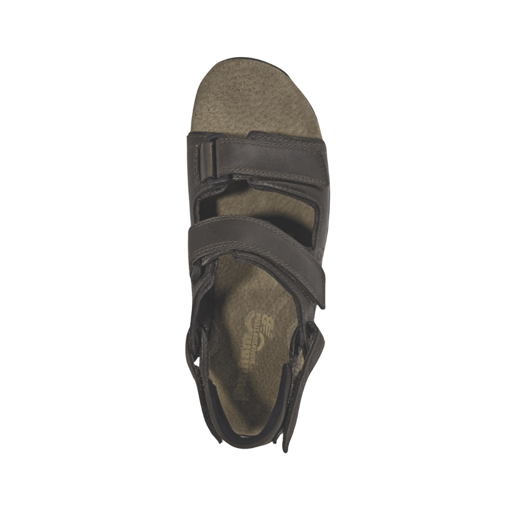 Top view of the Dunham Men’s St. Johnsbury Sandal in Brown Leather displaying the premium leather upper, three-point adjustable hook-and-loop straps, moisture-wicking lining, supportive footbed, and open design engineered to provide a secure, personalized fit and breathable comfort.