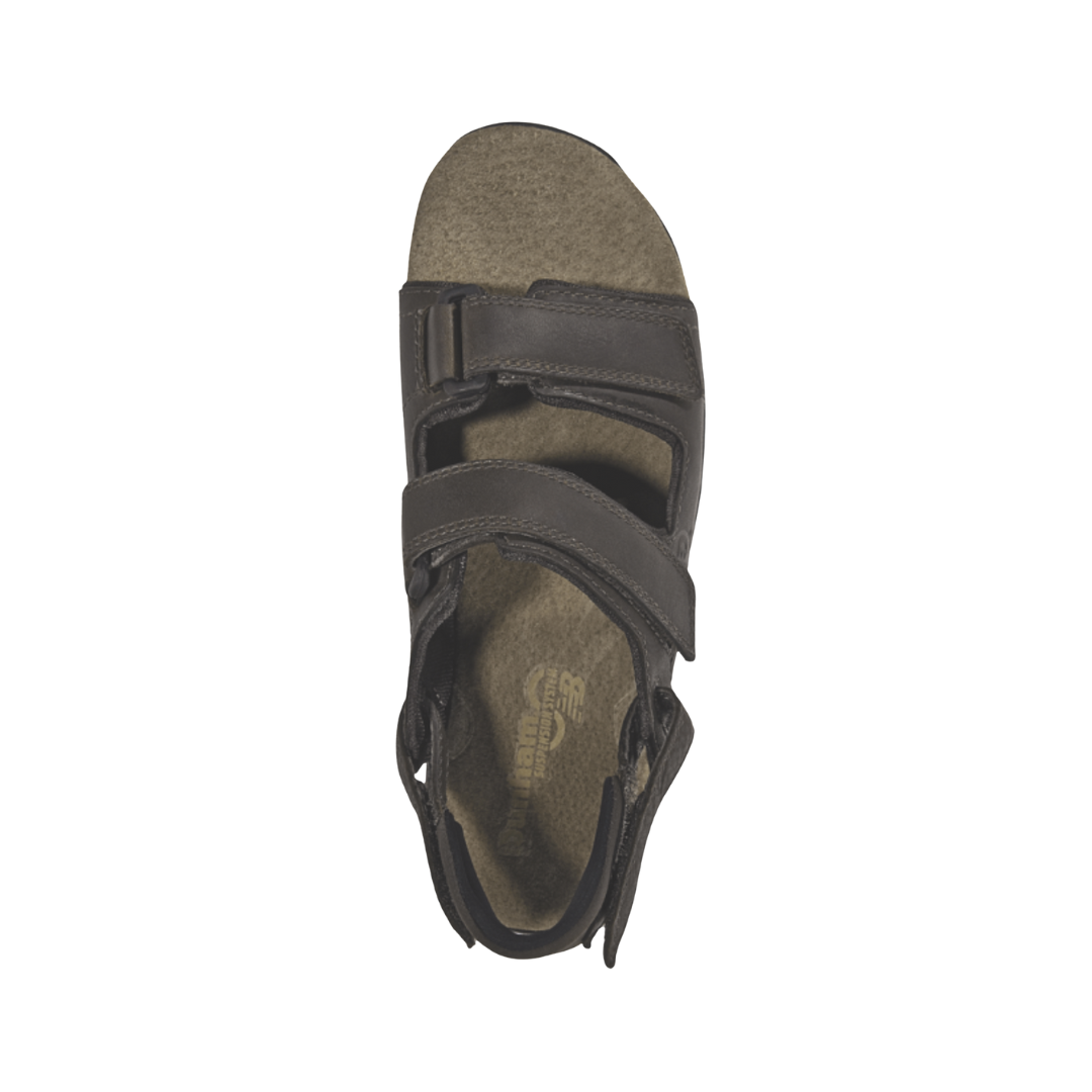 Top view of the Dunham Men’s St. Johnsbury Sandal in Brown Leather displaying the premium leather upper, three-point adjustable hook-and-loop straps, moisture-wicking lining, supportive footbed, and open design engineered to provide a secure, personalized fit and breathable comfort.