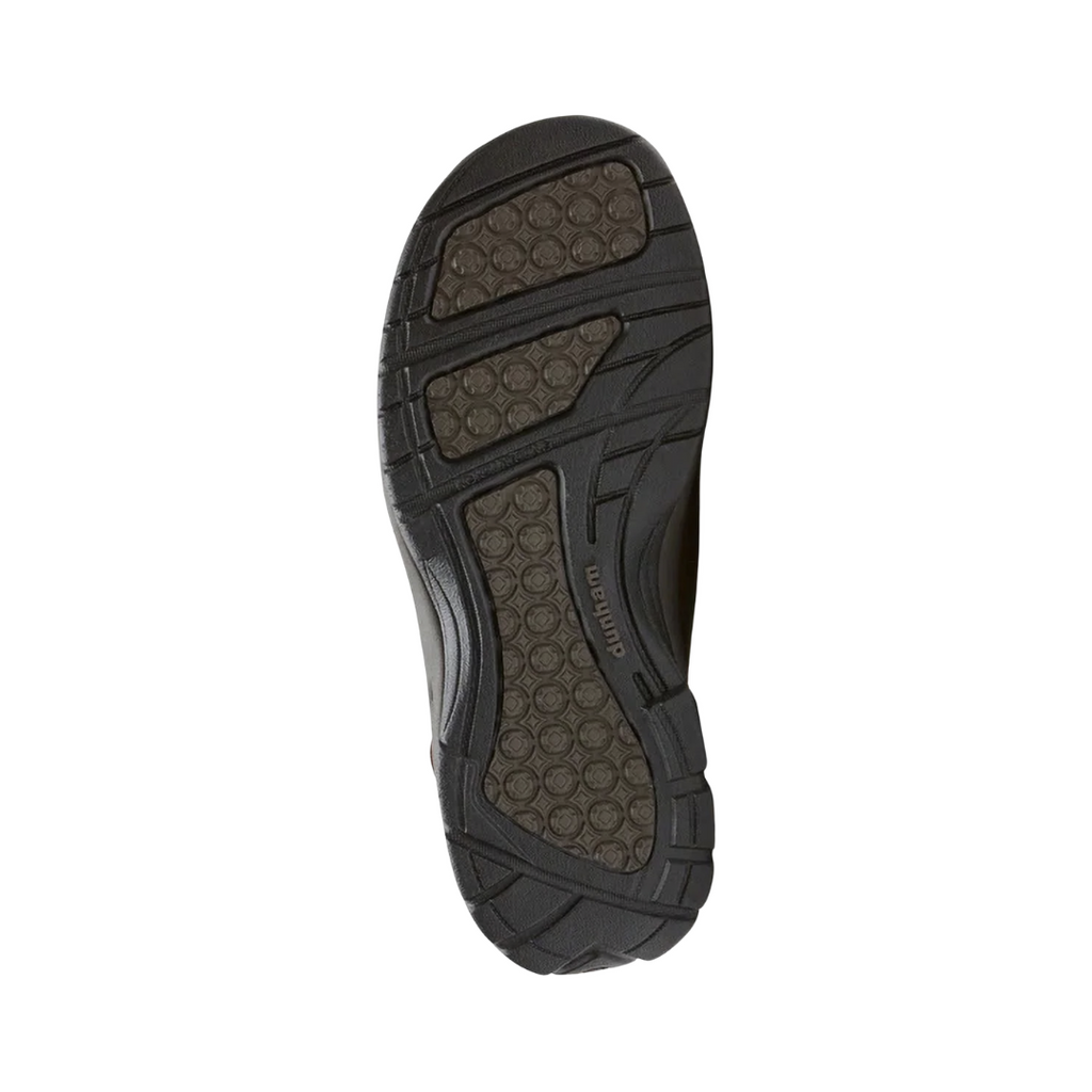 Bottom outsole view of the Dunham Men’s St. Johnsbury Sandal in Brown Leather featuring the durable rubber outsole designed to provide slip-resistant traction across a variety of surfaces while the Stability R-Bar technology, nylon shank, and supportive construction help provide comfort for conditions such as plantar fasciitis, heel pain, flat feet, overpronation, bunions, diabetic-sensitive feet, arthritis, joint pain, and general foot fatigue.