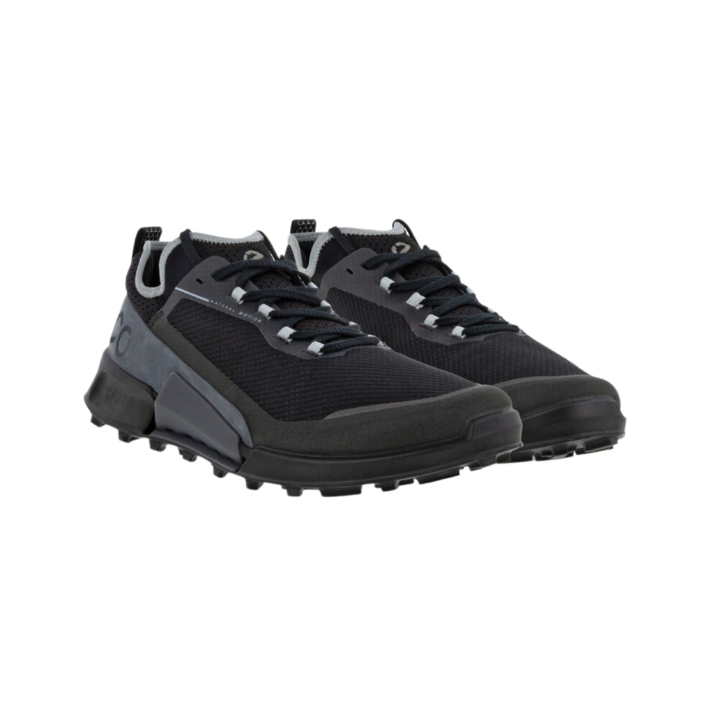 ECCO BIOM 2.1 X Country Low Hiking Shoe in Black/Magnet featuring a durable ripstop mesh upper, ECCO BIOM® Natural Motion Technology, PHORENE™ midsole cushioning, all-terrain rubber outsole, reflective detailing, and removable orthotic-friendly insole designed for lightweight support and off-road performance.