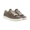 ECCO Women’s Soft 7 Sneaker in Taupe featuring a premium leather upper, full lace-up closure, FLUIDFORM™ Direct Comfort Technology, removable leather-covered insole, breathable textile lining, and durable PU/TPU outsole designed for clean Scandinavian style and supportive everyday comfort.