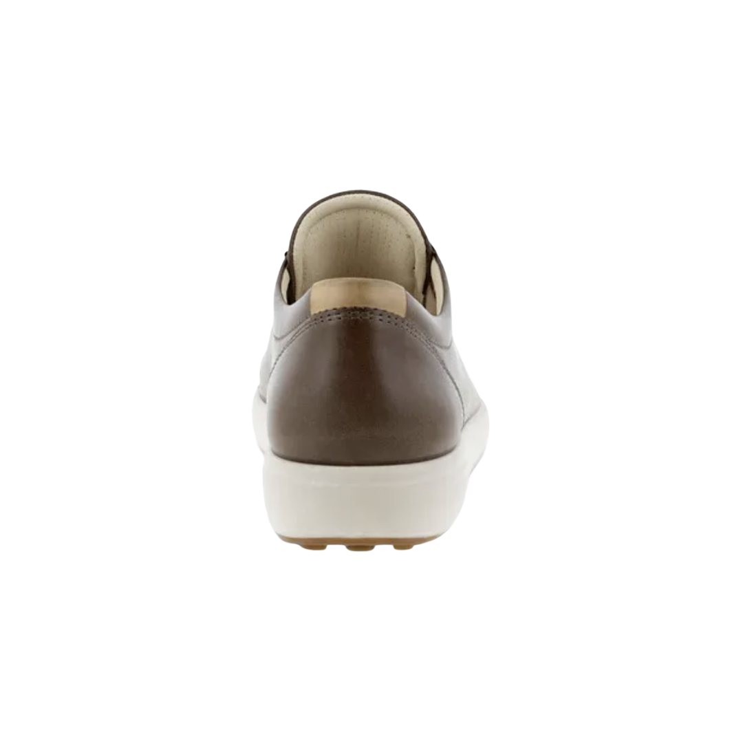 Back heel view of the ECCO Women’s Soft 7 Sneaker in Taupe highlighting the supportive heel construction, soft textile lining, cushioned FLUIDFORM™ sole, and durable PU/TPU outsole designed to provide stability, flexibility, and shock absorption throughout the day.
