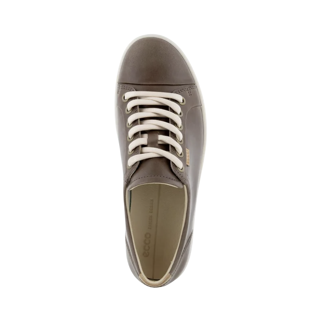 Top view of the ECCO Women’s Soft 7 Sneaker in Taupe displaying the premium leather upper, full lace-up system, removable leather-covered insole, breathable textile lining, and streamlined design engineered to provide a customizable fit while accommodating custom orthotics or supportive inserts.