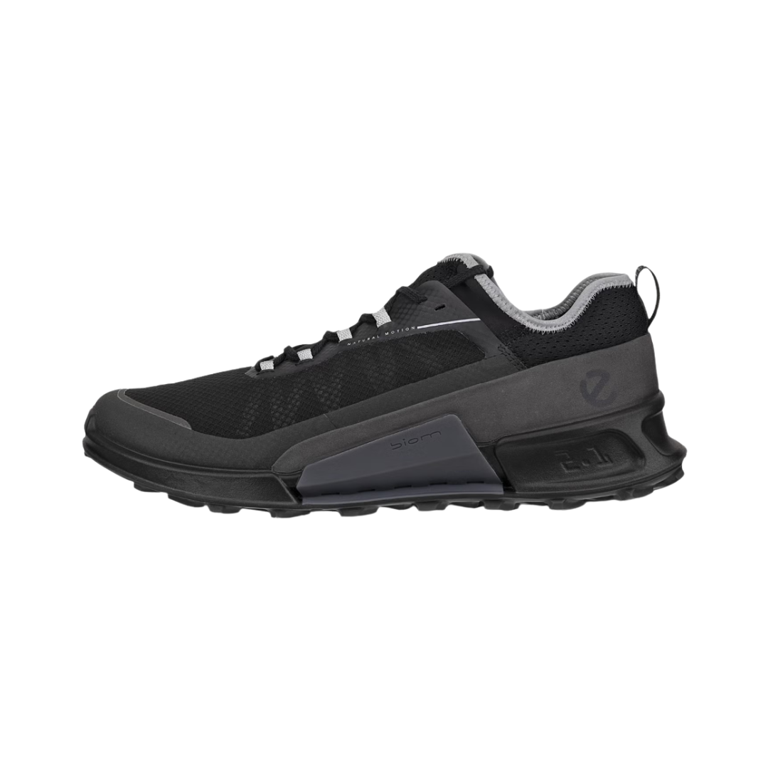 ECCO BIOM 2.1 X Country Low Hiking Shoe in Black/Magnet featuring a durable ripstop mesh upper, ECCO BIOM® Natural Motion Technology, PHORENE™ midsole cushioning, all-terrain rubber outsole, reflective detailing, and removable orthotic-friendly insole designed for lightweight support and off-road performance.