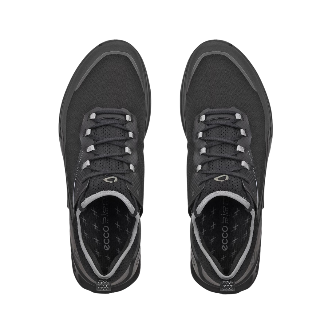 Top view of the ECCO BIOM 2.1 X Country Low Hiking Shoe in Black/Magnet displaying the breathable ripstop mesh upper, secure lace-up system, removable insole, supportive interior construction, and low-profile design engineered to promote natural foot movement and a comfortable personalized fit.