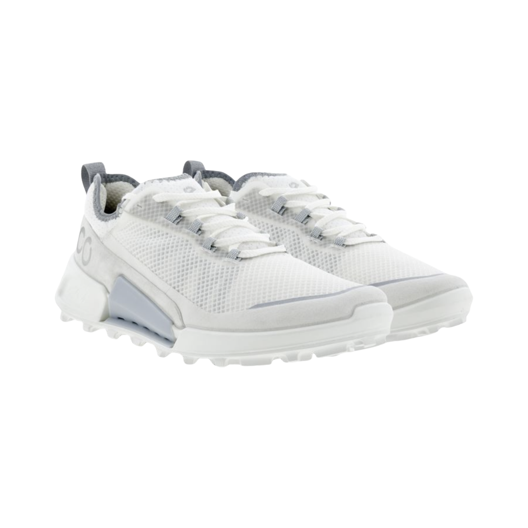 ECCO Women’s BIOM 2.1 X Country Low in Shadow White featuring a lightweight mesh and synthetic upper, BIOM® Natural Motion® Technology, soft textile lining, OrthoLite® removable insole, reinforced toe guard, and flexible rubber outsole with aggressive lugs designed for natural movement, stability, and trail-ready traction.