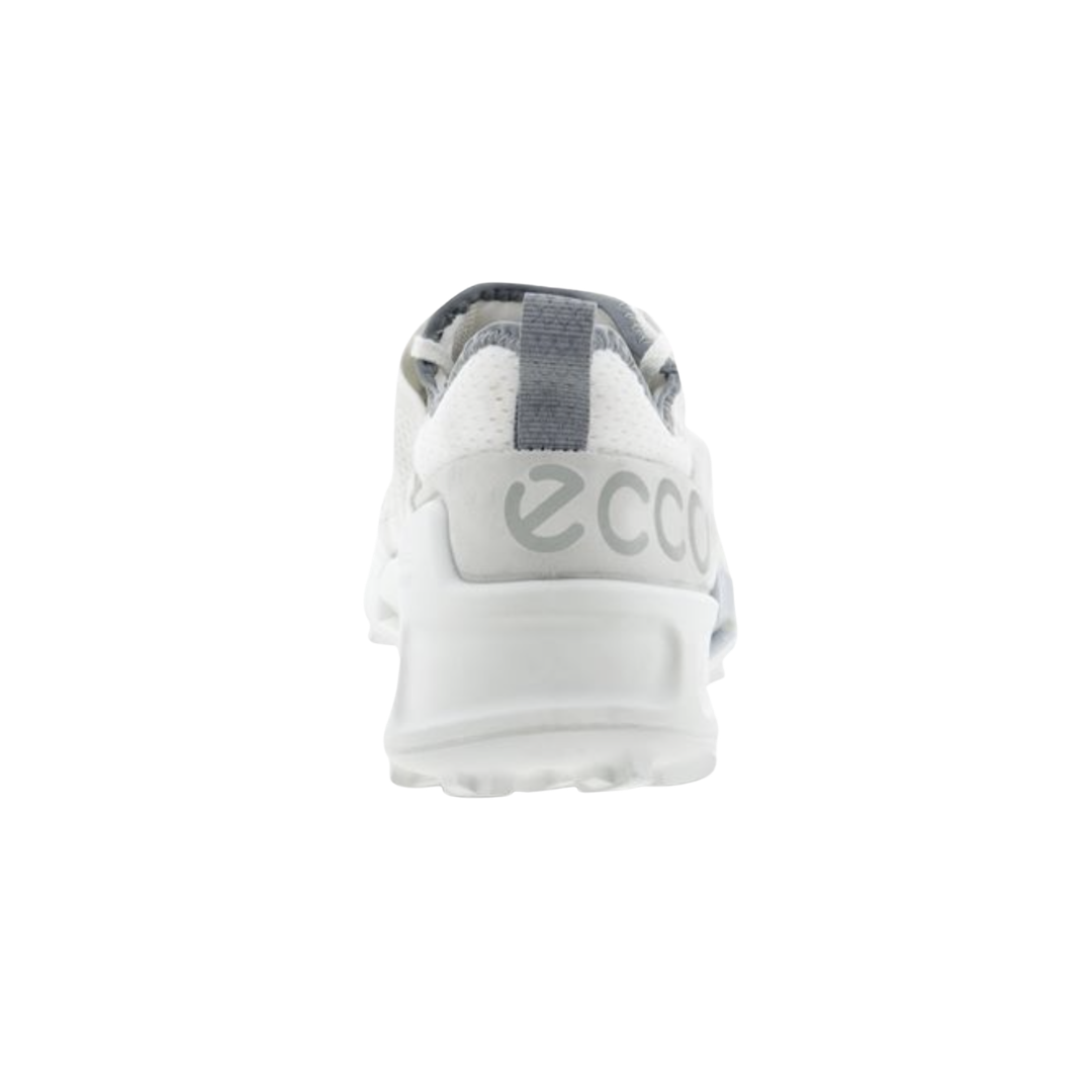 Back heel view of the ECCO Women’s BIOM 2.1 X Country Low in Shadow White highlighting the supportive heel construction, soft textile lining, cushioned OrthoLite® insole, and durable rubber outsole designed to enhance stability, absorb impact, and provide dependable support during long walks and hikes.