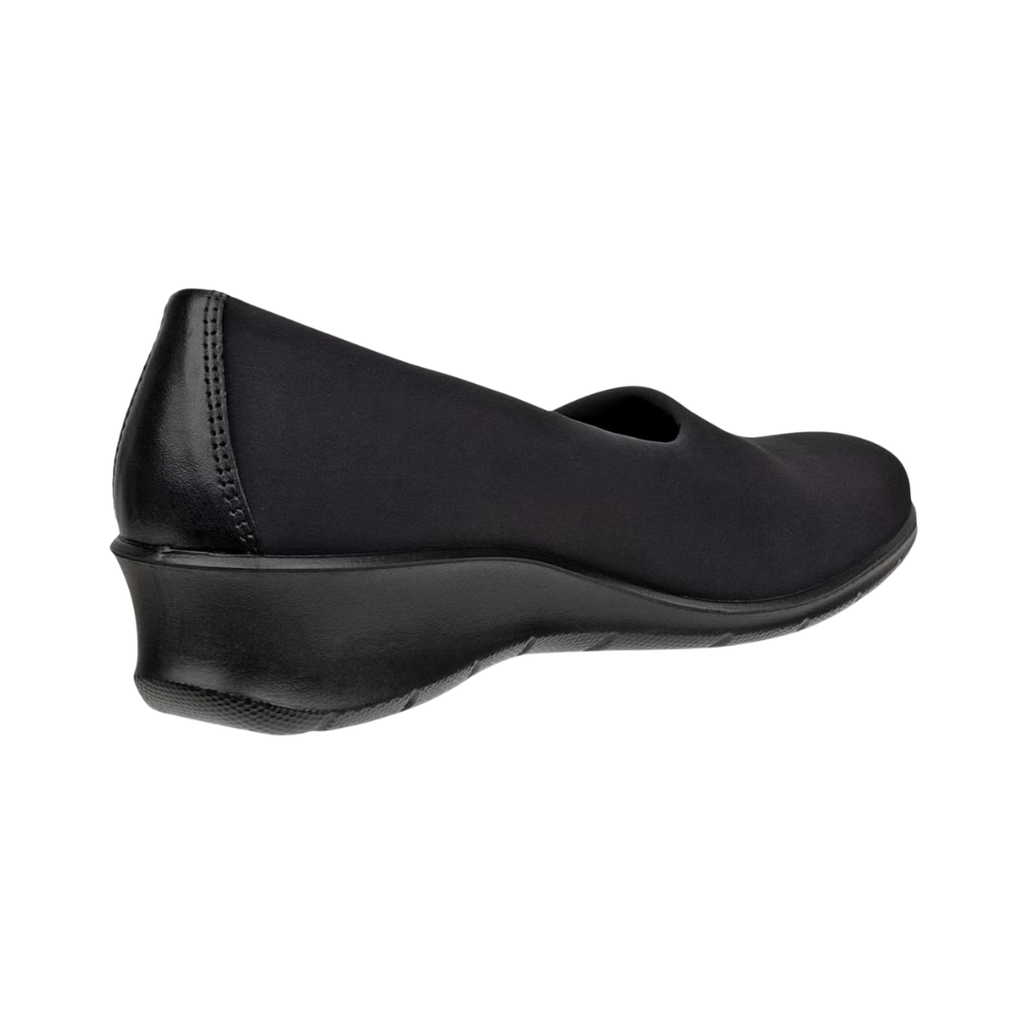 Back heel view of the ECCO Women’s Felicia Stretch Slip-On in Black highlighting the supportive heel construction, subtle 1.5-inch wedge heel, cushioned FLUIDFORM™ sole, and shock-absorbing PU outsole designed to provide balance, stability, and comfortable movement.