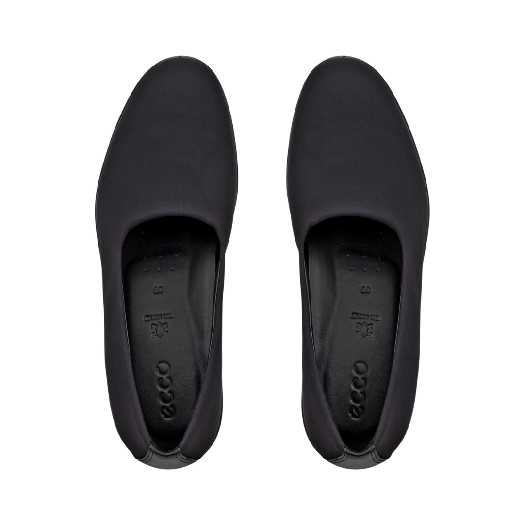 Top view of the ECCO Women’s Felicia Stretch Slip-On in Black displaying the suede and stretch textile upper, hidden elastic gores, flexible fit, and removable insole designed to provide easy slip-on convenience while accommodating custom orthotics or supportive inserts.