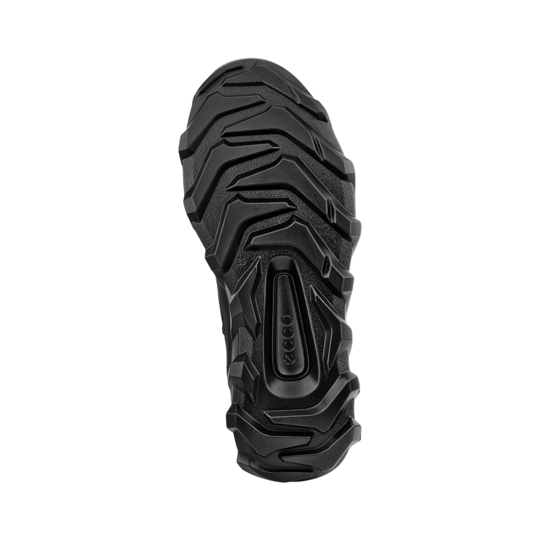 Bottom outsole view of the ECCO MX Low in Black featuring the motocross-inspired rubber outsole with deep multi-directional lugs engineered to provide advanced grip and stability across mixed terrain while FLUIDFORM™ Direct Comfort Technology and the cushioned construction help provide comfort for conditions such as plantar fasciitis, flat feet, overpronation, metatarsalgia, arthritis, joint pain, and general foot fatigue.