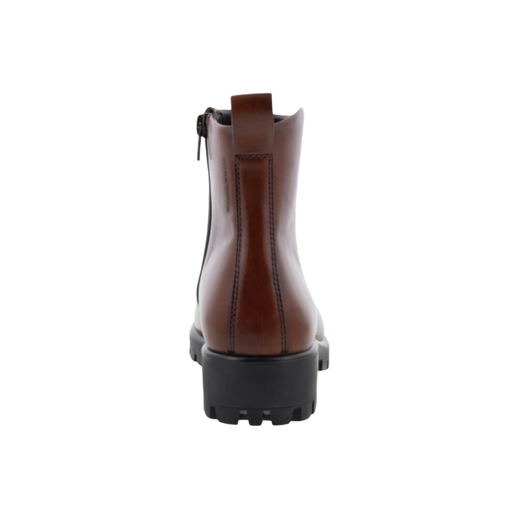 Back heel view of the ECCO Women’s Modtray Ankle Boot in Cognac highlighting the supportive ankle construction, chunky platform heel, cushioned FLUIDFORM™ sole, and lugged rubber outsole designed to provide stability, traction, and reduced fatigue.