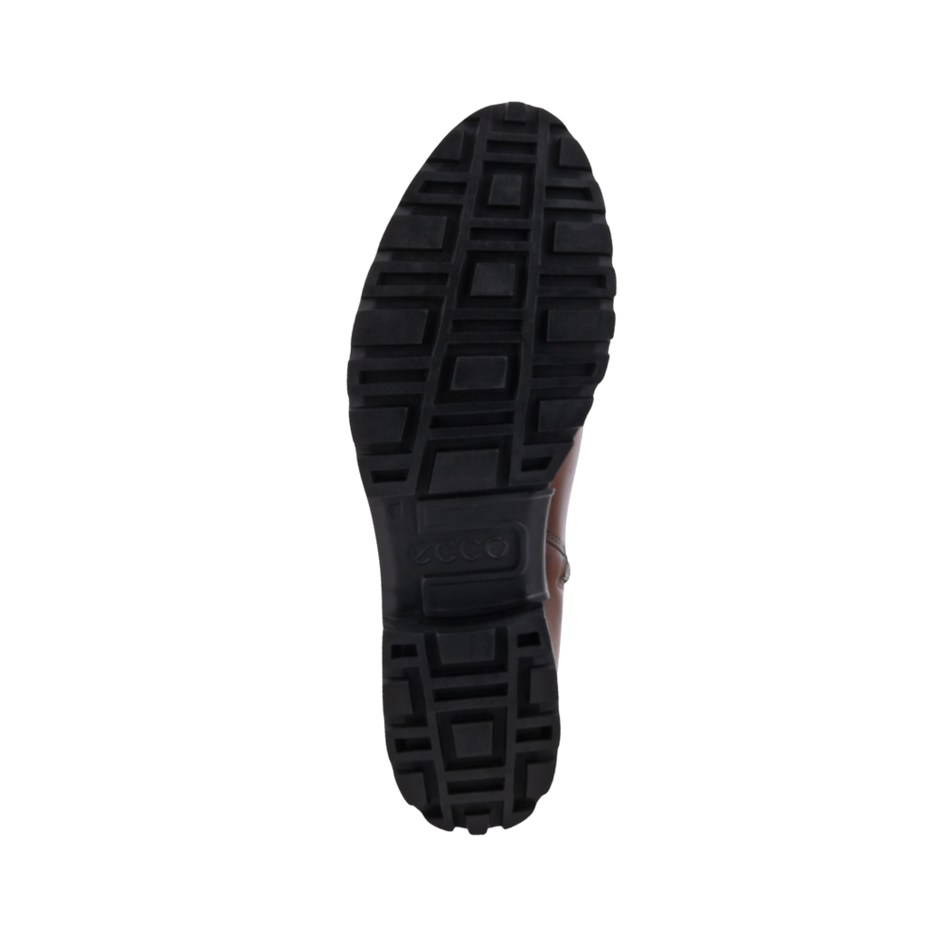 Bottom outsole view of the ECCO Women’s Modtray Ankle Boot in Cognac featuring the chunky lugged rubber outsole engineered to provide excellent traction and stability on slick streets and uneven terrain while FLUIDFORM™ Direct Comfort Technology provides flexible cushioning and support for conditions such as plantar fasciitis, flat feet, overpronation, heel pain, joint pain, bunions, forefoot pain, and general foot fatigue.