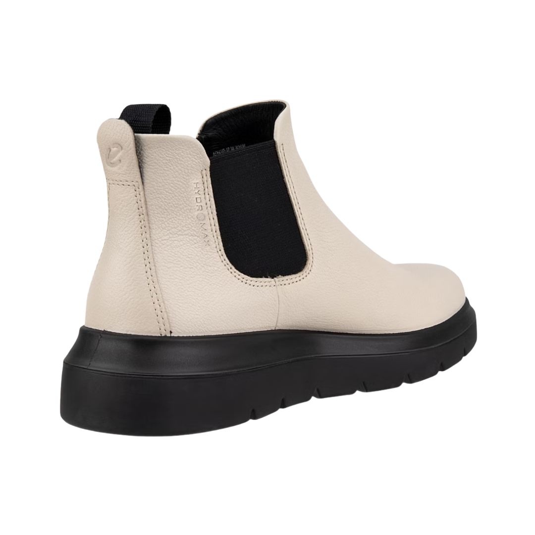 Back heel view of the ECCO Women’s Nouvelle Chelsea Boot in Limestone highlighting the supportive ankle-height construction, low block heel, cushioned FLUIDFORM™ sole, and lightweight PU outsole designed to provide stability, shock absorption, and comfortable everyday movement.