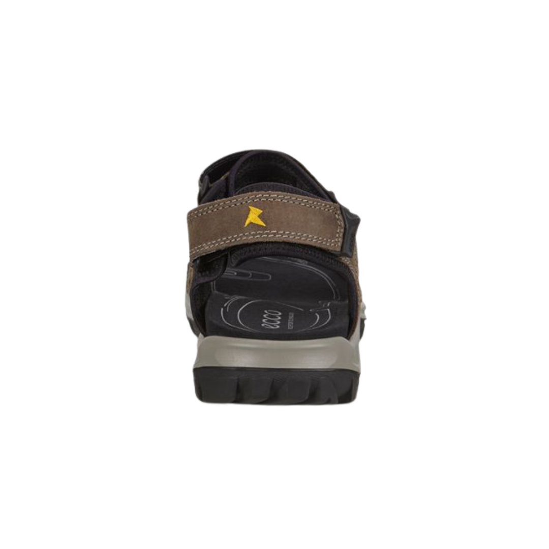 Back heel view of the ECCO Offroad Lite Sandal in Dark Clay highlighting the adjustable heel and ankle straps, supportive rearfoot construction, shock-absorbing midsole, and durable rubber outsole designed to enhance stability and reduce impact during walking and outdoor activities.