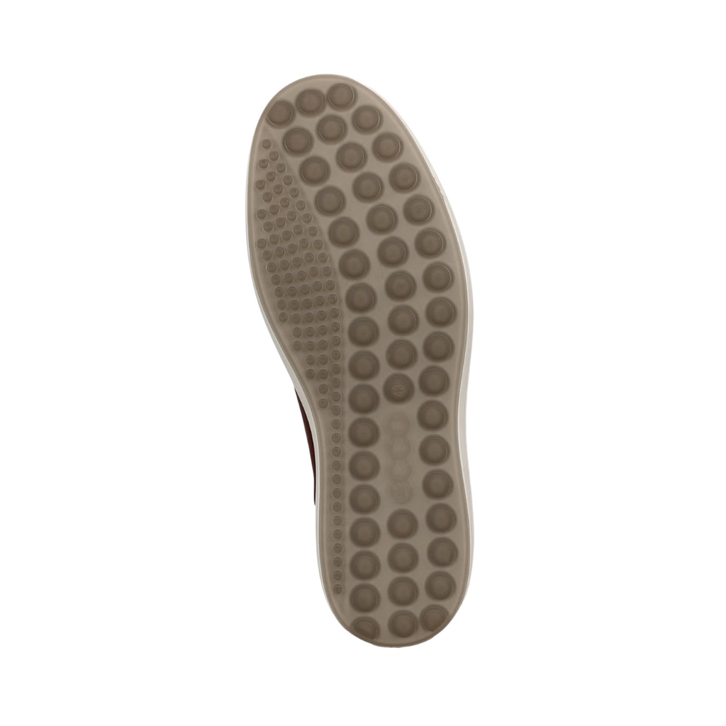 Bottom view of the ECCO Men’s Soft 7 City Sneaker in Cognac, highlighting the durable PU/TPU outsole with flexible traction design for reliable grip on a variety of surfaces.