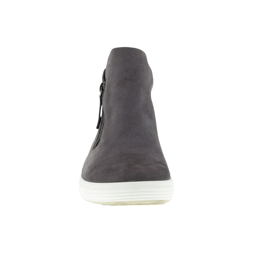 Front view of the ECCO Women’s Soft 7 Zip Bootie in Gravity showcasing the dark grey nubuck upper, sleek ankle-height silhouette, and clean Scandinavian-inspired styling designed to pair effortlessly with casual or polished outfits.