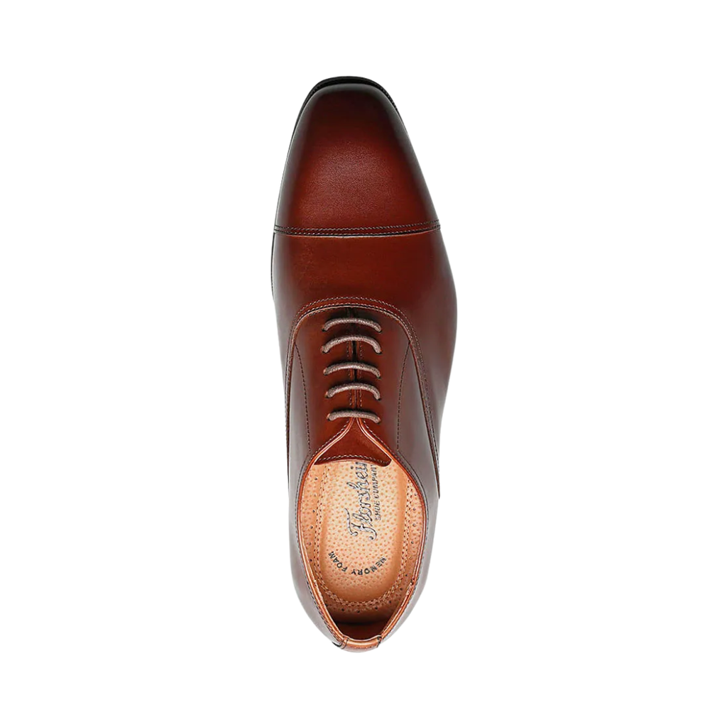 Top view of the Florsheim Corbetta Cap-Toe Oxford in Cognac displaying the burnished leather finish, traditional lace-up closure, and cap-toe detailing for a sophisticated, polished appearance.