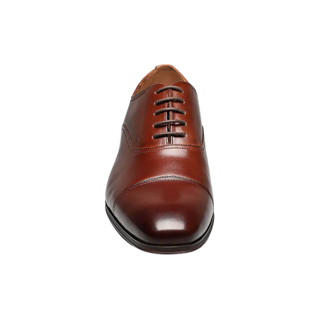 Front view of the Florsheim Corbetta Cap-Toe Oxford in Cognac showcasing the classic cap-toe design, burnished leather finish, and refined lace-up silhouette suited for professional, formal, and upscale casual wear.