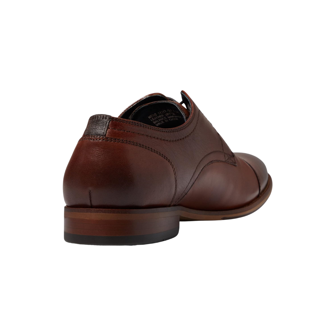 Back heel view of the Florsheim Flex Cap-Toe Oxford in Cognac highlighting the smooth leather construction and flexible rubber outsole designed for dependable traction and comfortable movement.