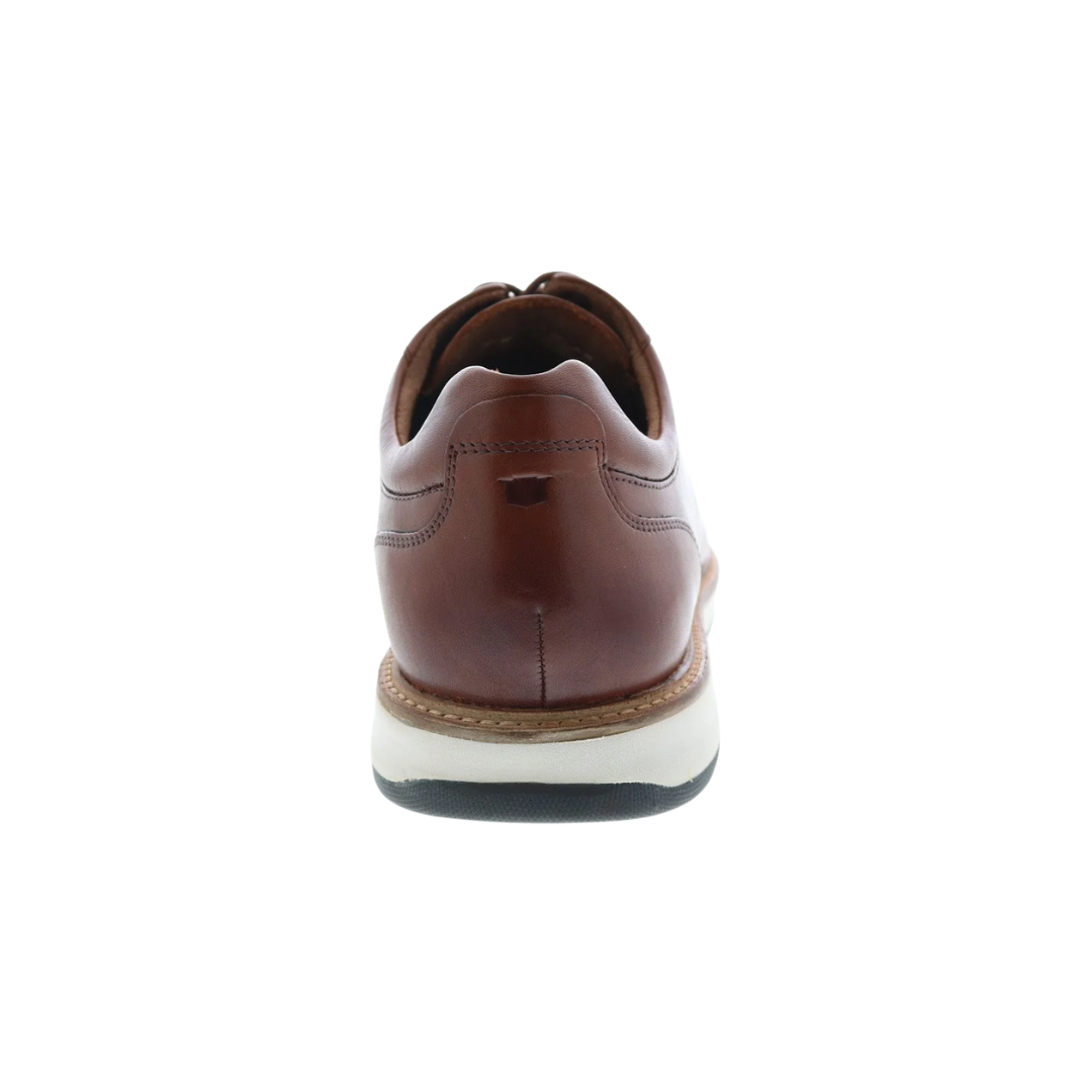Back heel view of the Florsheim Scarsdale Plain-Toe Oxford in Cognac highlighting the smooth leather construction and flexible rubber outsole designed for stable, comfortable movement.