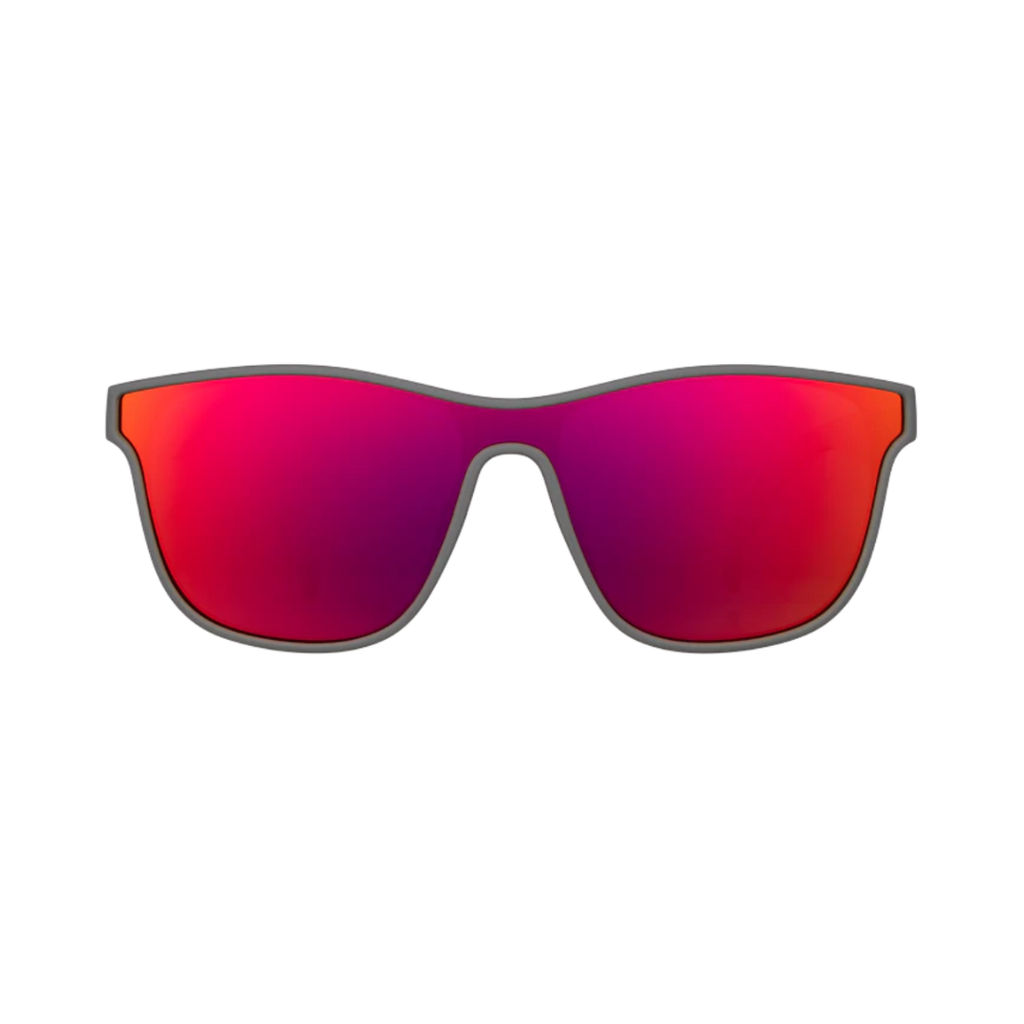 Front view of the Goodr VRG "Voight-Kampff Vision" sunglasses showcasing the streamlined wraparound silhouette, graphite frame, and reflective pink-red polarized lenses with UV400 protection for glare reduction and full UVA and UVB coverage.
