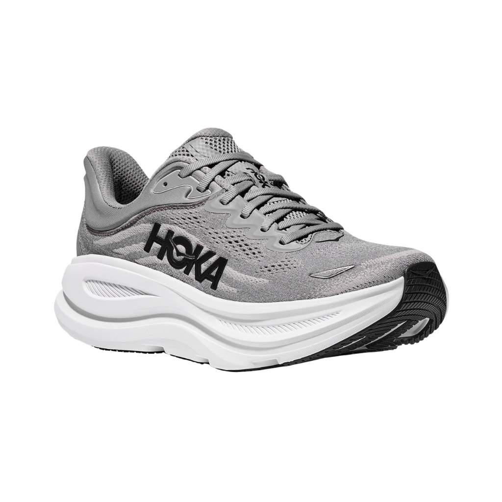 Side view of the HOKA Men’s Bondi 9 in Galactic Grey/Stellar Grey, showcasing the thick super critically foamed EVA midsole, smooth MetaRocker™ profile, and breathable recycled polyester upper for maximum cushioned support.