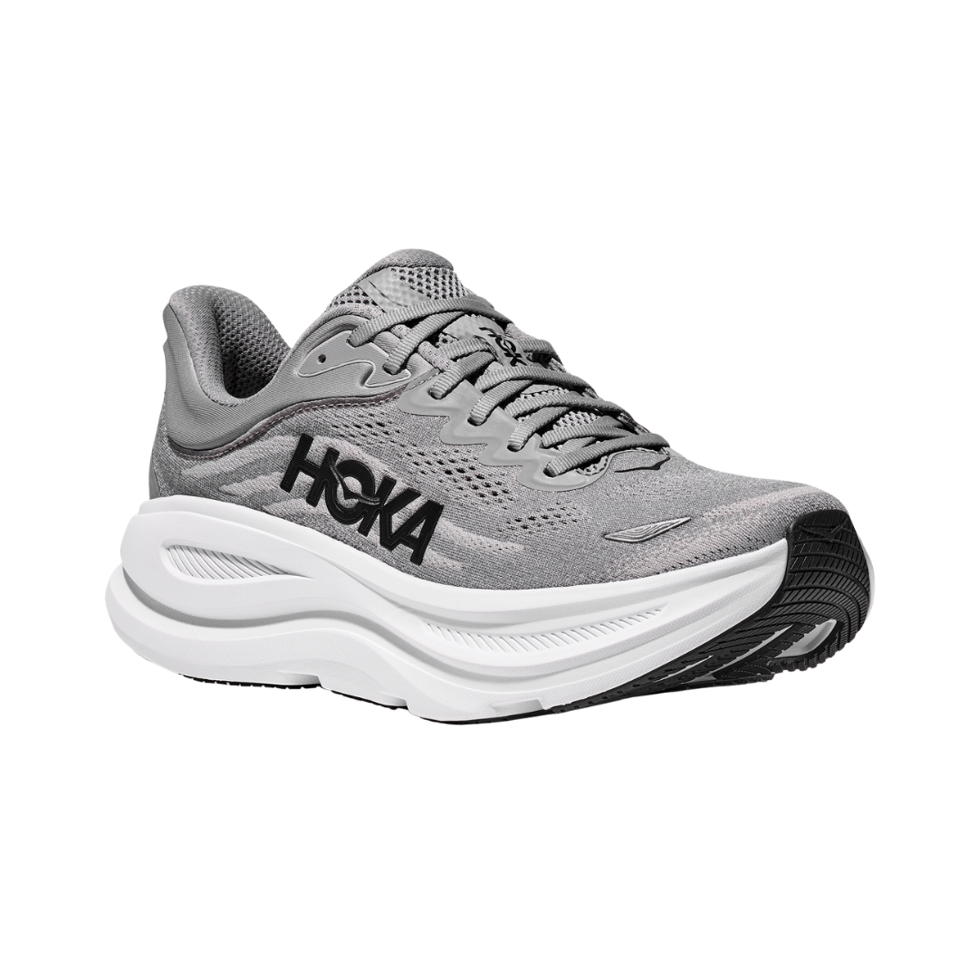 Side view of the HOKA Men’s Bondi 9 in Galactic Grey/Stellar Grey, showcasing the thick super critically foamed EVA midsole, smooth MetaRocker™ profile, and breathable recycled polyester upper for maximum cushioned support.