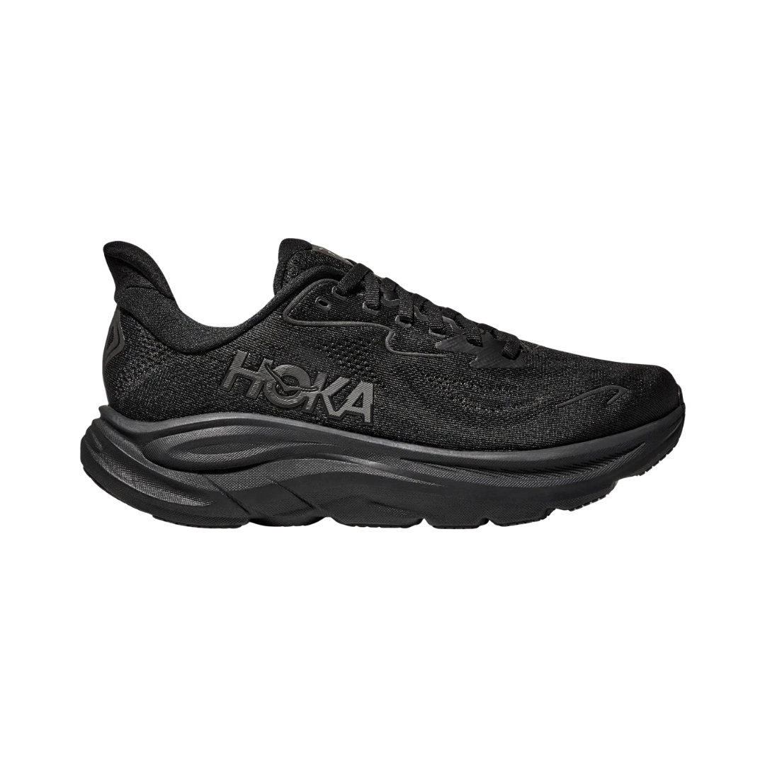 Side view of the HOKA Women’s Clifton 10 in Black/Black, showcasing the lightweight jacquard knit upper, plush CMEVA midsole cushioning, and smooth MetaRocker™ geometry for a soft, efficient ride.