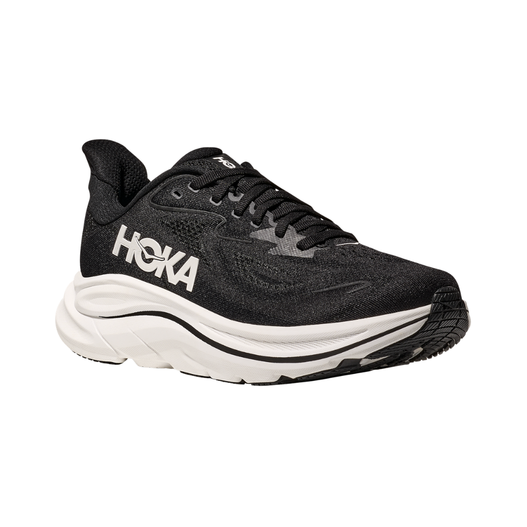 Side view of the HOKA Women’s Clifton 10 in Black/White, showcasing the lightweight jacquard knit upper, plush CMEVA midsole cushioning, and smooth MetaRocker™ geometry for a soft, efficient ride.