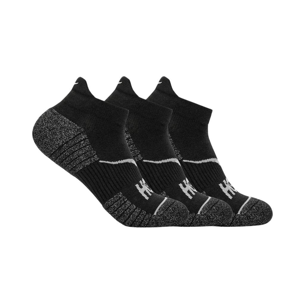 Side view of the HOKA Unisex No-Show Run Socks in Black, featuring the low-profile ankle-grazing design, form-fitting construction, and engineered arch support for a secure fit during running, walking, and training.