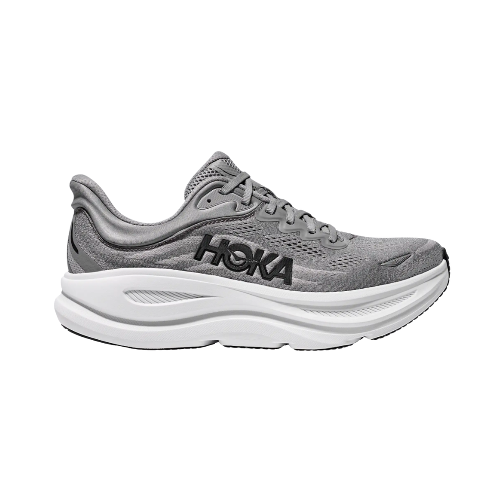 Side view of the HOKA Men’s Bondi 9 in Galactic Grey/Stellar Grey, showcasing the thick super critically foamed EVA midsole, smooth MetaRocker™ profile, and breathable recycled polyester upper for maximum cushioned support.