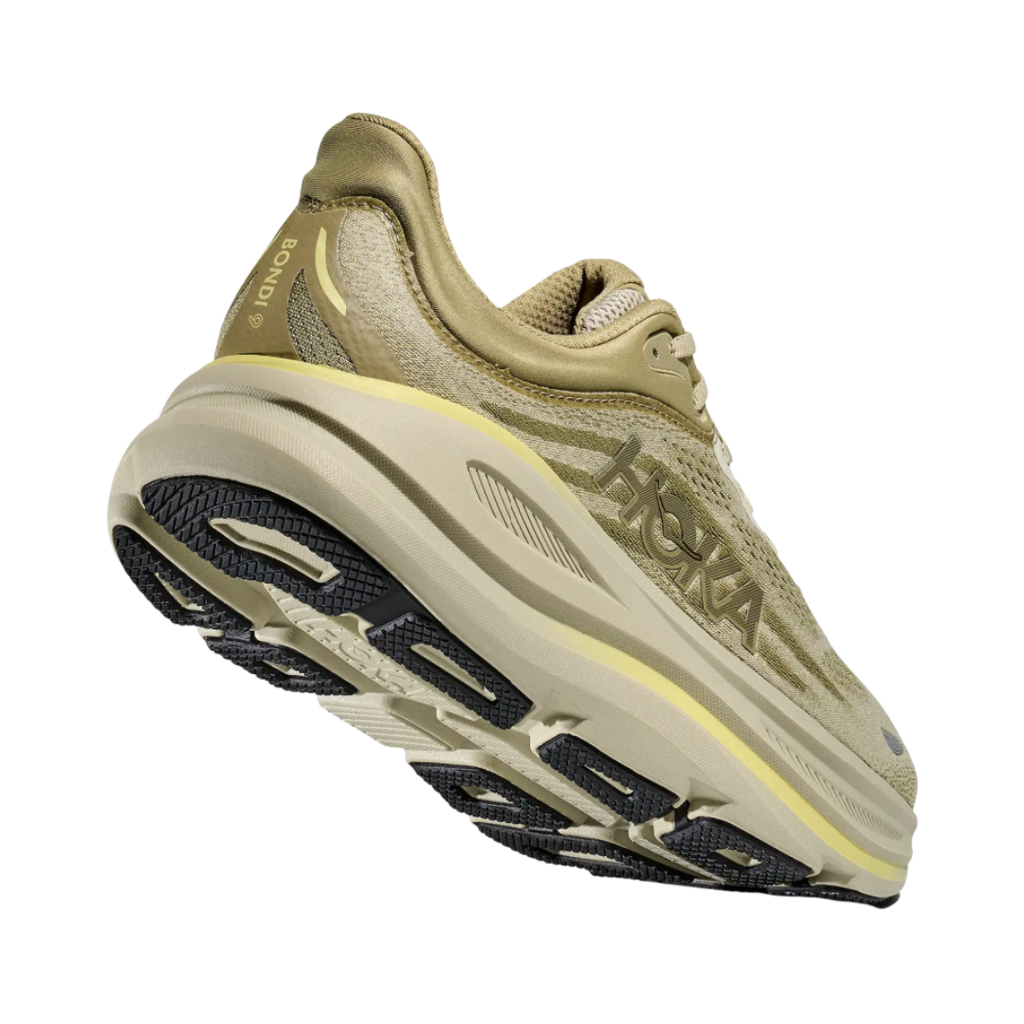 Bottom heel view of the HOKA Men’s Bondi 9 in Grassland/Oyster Mushroom, highlighting the Durabrasion rubber outsole with high-wear traction zones for durability and reliable grip.